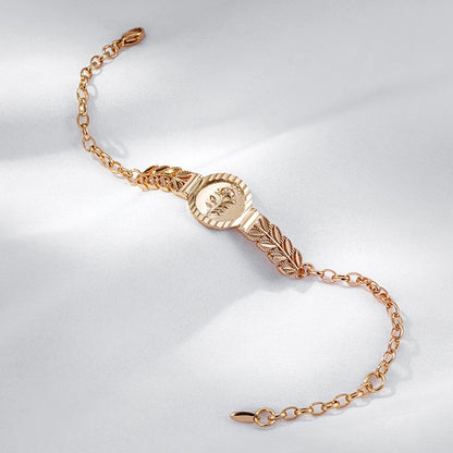 Pulseira Elegante com Correntes em Forma de Folhas e Flor Central em Molde Circular, Acabamento em Ouro Rosé 14K