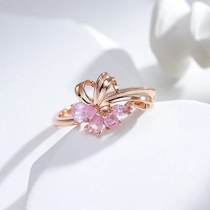 Anel Elegante com Design de Linhas Curvas e Zircônias em Rosa Choque, Acabamento em Ouro Rosé 14K